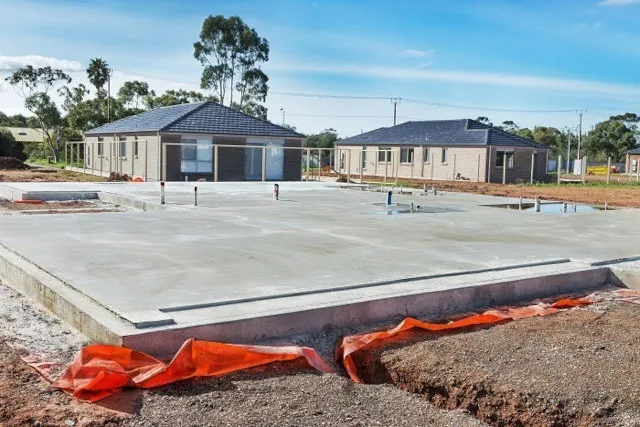 flooring system, slab-on-grade foundation, Ultimate Classroom flooring, sustainable flooring, concrete slab, subfloor preparation, durable flooring, green building, foundation design, DIY construction